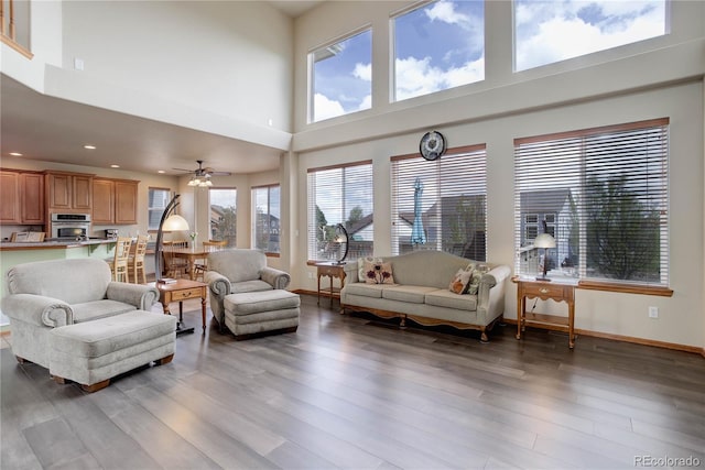 12754 Angelina Dr, Peyton, CO 80831 - living room with a towering ceiling, recessed lighting, light wood-style floors, and a ceiling fan