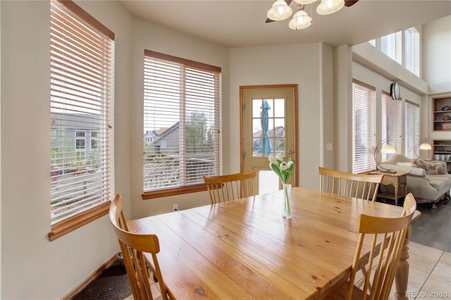 12754 Angelina Dr, Peyton, CO 80831 - dining room featuring healthy amount of natural light and a chandelier