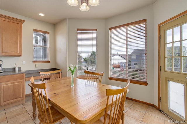 12754 Angelina Dr, Peyton, CO 80831 - dining area with light tile patterned floors, healthy amount of natural light, a chandelier, and recessed lighting