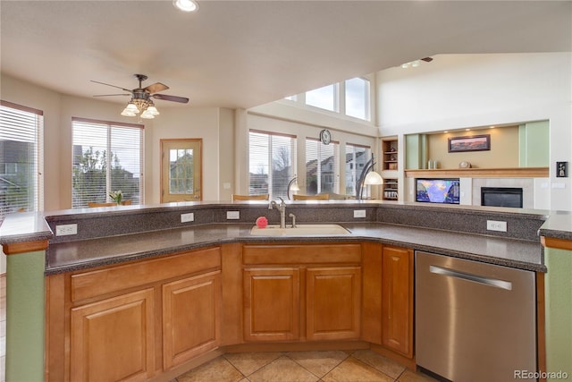 12754 Angelina Dr, Peyton, CO 80831 - kitchen featuring stainless steel dishwasher, open floor plan, healthy amount of natural light, a ceiling fan, and recessed lighting