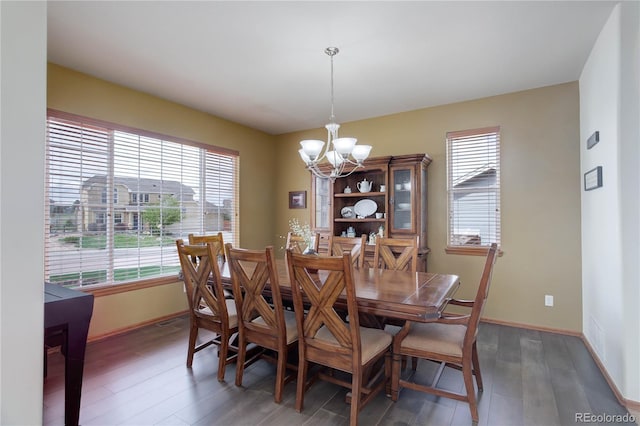 12754 Angelina Dr, Peyton, CO 80831 - dining area with a chandelier, plenty of natural light, and light wood finished floors