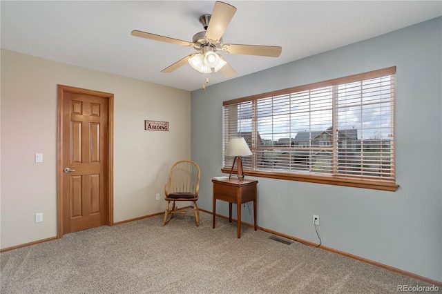 12754 Angelina Dr, Peyton, CO 80831 - living area featuring light carpet and ceiling fan