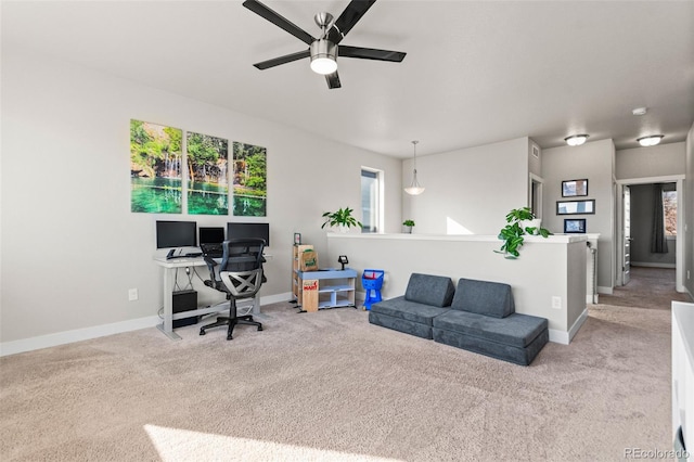 home office featuring a ceiling fan, carpet, and baseboards