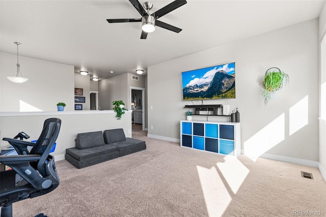 interior space featuring baseboards, visible vents, and carpet floors