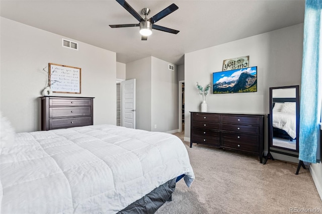 bedroom with visible vents, a ceiling fan, and carpet