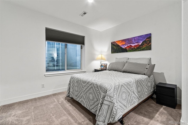 bedroom featuring carpet flooring, baseboards, and visible vents