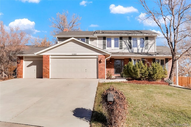 view of front facade featuring a front yard and a garage