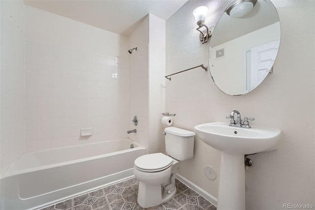 full bathroom featuring tile patterned flooring,  shower combination, toilet, and sink