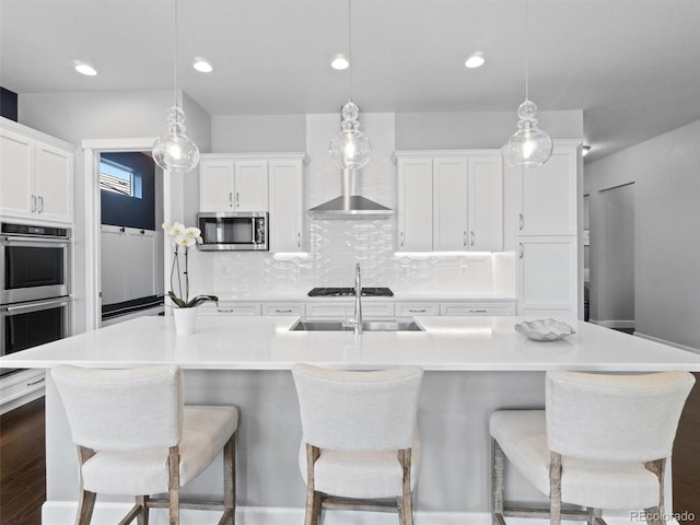 6268 Dakota Ridge Dr, Littleton, CO 80125 - kitchen featuring stainless steel appliances, white cabinets, light countertops, tasteful backsplash, and recessed lighting