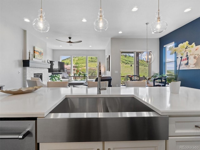 6268 Dakota Ridge Dr, Littleton, CO 80125 - kitchen featuring a sink, open floor plan, recessed lighting, light countertops, and a ceiling fan
