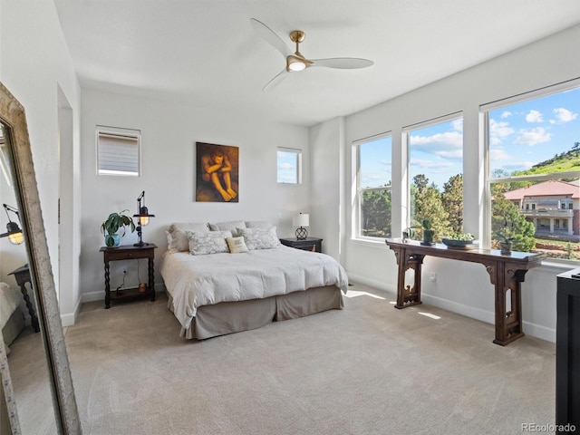 6268 Dakota Ridge Dr, Littleton, CO 80125 - bedroom featuring light carpet, baseboards, and ceiling fan