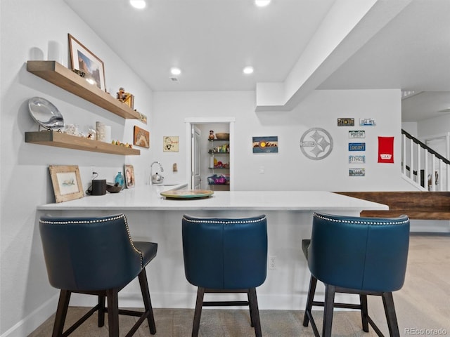 6268 Dakota Ridge Dr, Littleton, CO 80125 - indoor wet bar featuring recessed lighting and stairs