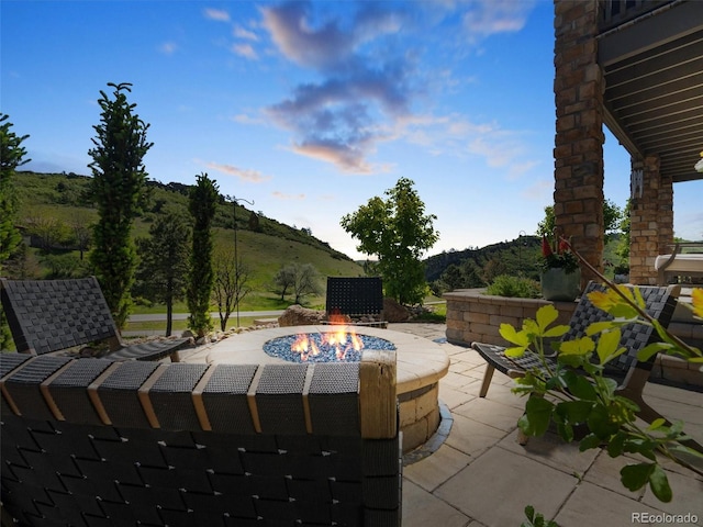6268 Dakota Ridge Dr, Littleton, CO 80125 - view of patio / terrace with a mountain view and a fire pit