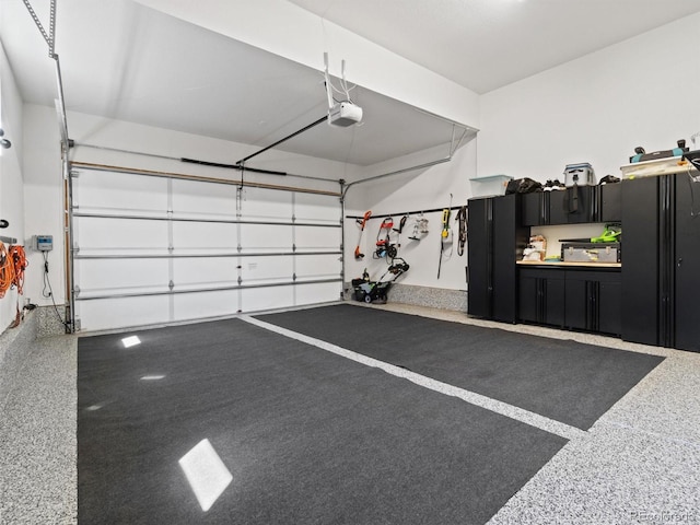 6268 Dakota Ridge Dr, Littleton, CO 80125 - garage featuring a garage door opener
