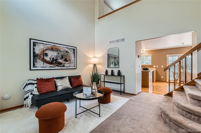 11363 Latigo Ln, Parker, CO 80138 - carpeted living area with stairway and a high ceiling