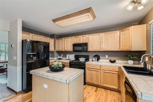 11363 Latigo Ln, Parker, CO 80138 - kitchen with black appliances, tile countertops, and light brown cabinets