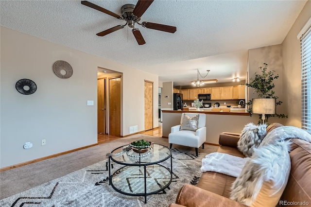 11363 Latigo Ln, Parker, CO 80138 - living room with a textured ceiling, a ceiling fan, a chandelier, and light carpet