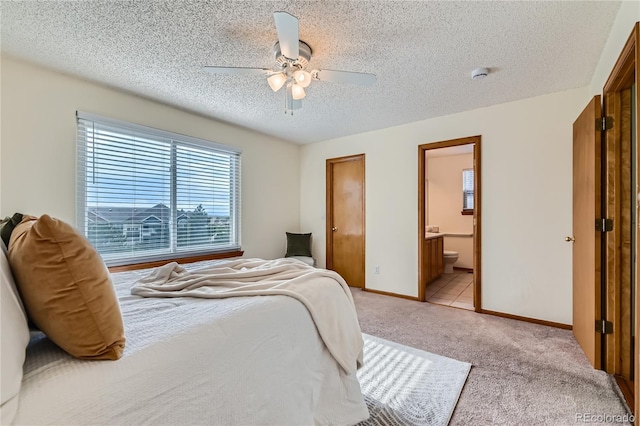 11363 Latigo Ln, Parker, CO 80138 - bedroom with a textured ceiling, light colored carpet, ceiling fan, and ensuite bath