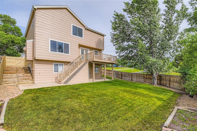 11363 Latigo Ln, Parker, CO 80138 - back of property featuring stairway, a fenced backyard, a deck, and a patio area