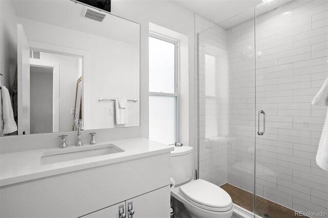 1250 W Osceola St Unit 2, Denver, CO 80204 - bathroom featuring vanity and a shower stall