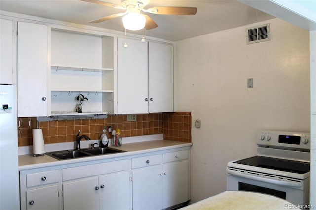 kitchen featuring ceiling fan, tasteful backsplash, white appliances, sink, and white cabinetry