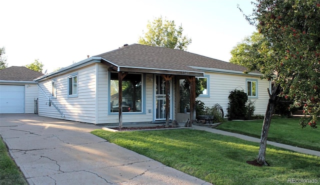 view of front of house featuring a garage and a front lawn