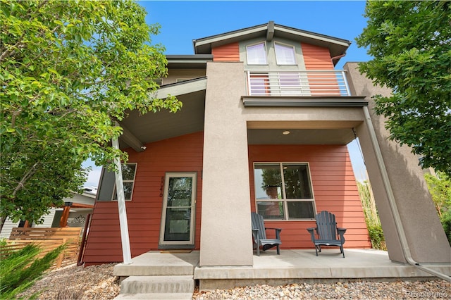 5046 Uinta St, Denver, CO 80238 - rear view of property with a balcony and stucco siding