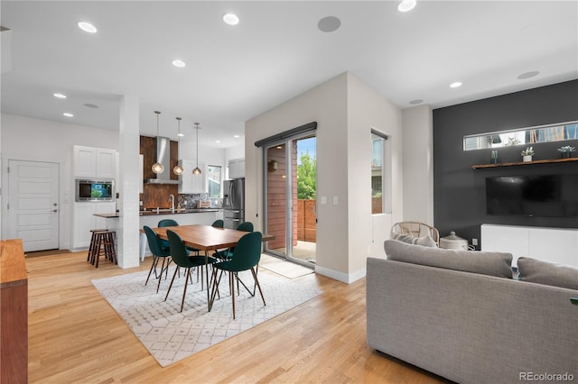5046 Uinta St, Denver, CO 80238 - dining space featuring light wood-style floors and recessed lighting