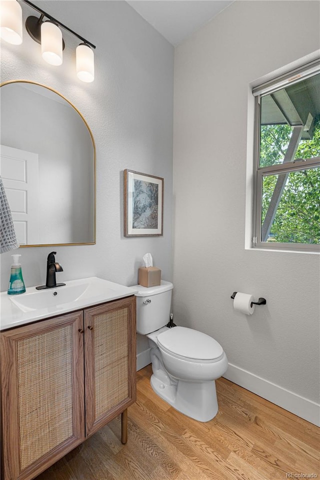 5046 Uinta St, Denver, CO 80238 - half bath featuring wood finished floors and vanity