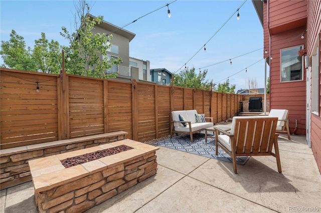 5046 Uinta St, Denver, CO 80238 - fenced backyard with a patio area and an outdoor living space with a fire pit