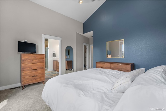 5046 Uinta St, Denver, CO 80238 - carpeted bedroom featuring high vaulted ceiling and ensuite bath