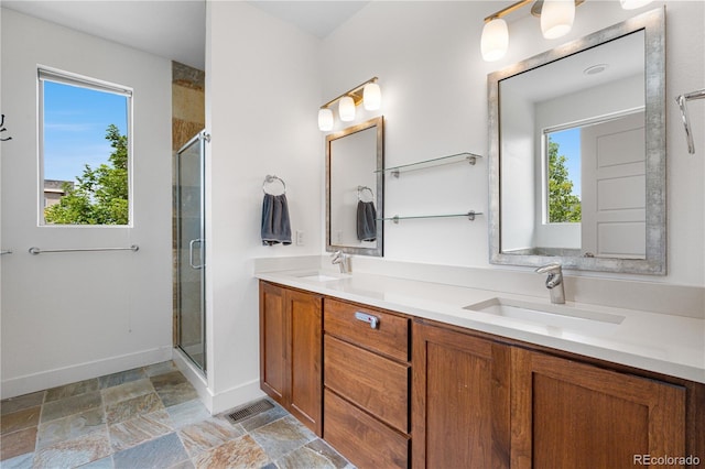 5046 Uinta St, Denver, CO 80238 - bathroom featuring healthy amount of natural light, a stall shower, and double vanity