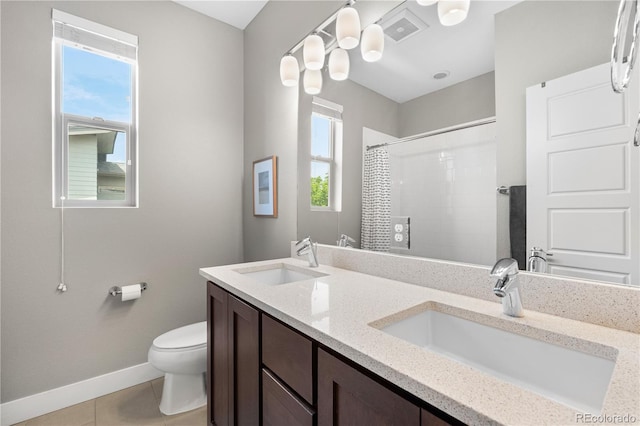 5046 Uinta St, Denver, CO 80238 - bathroom with a shower, double vanity, and tile patterned flooring