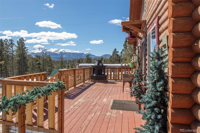 wooden deck with a mountain view