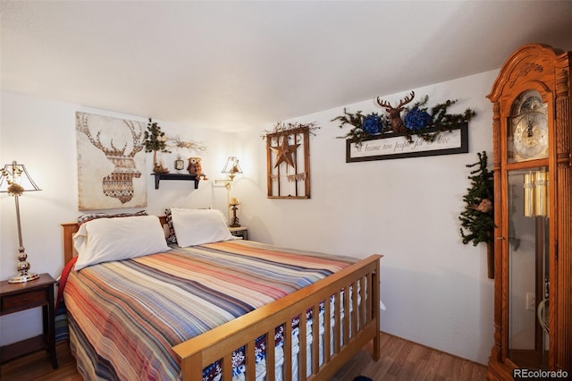 bedroom featuring wood finished floors