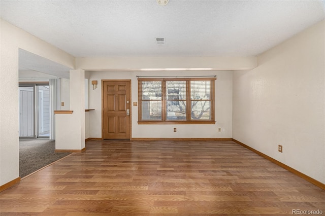 foyer entrance featuring wood-type flooring