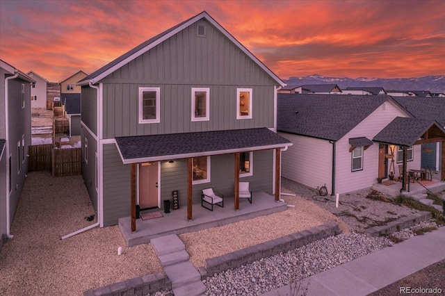 view of front of home featuring a mountain view and a patio