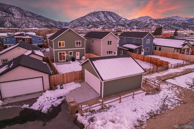 snowy aerial view featuring a mountain view