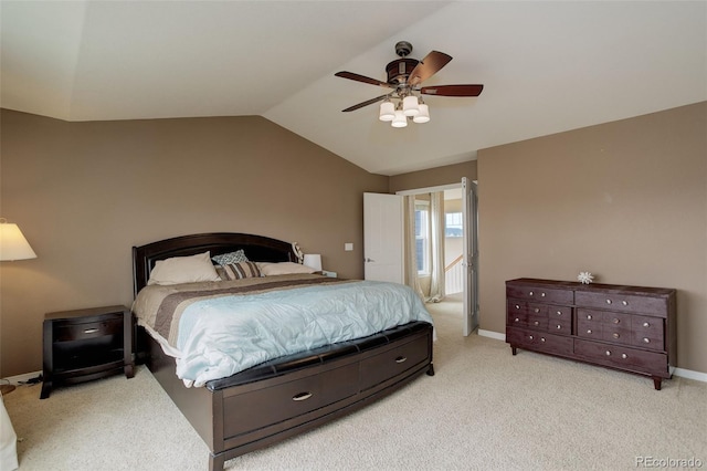carpeted bedroom featuring baseboards, ceiling fan, and vaulted ceiling