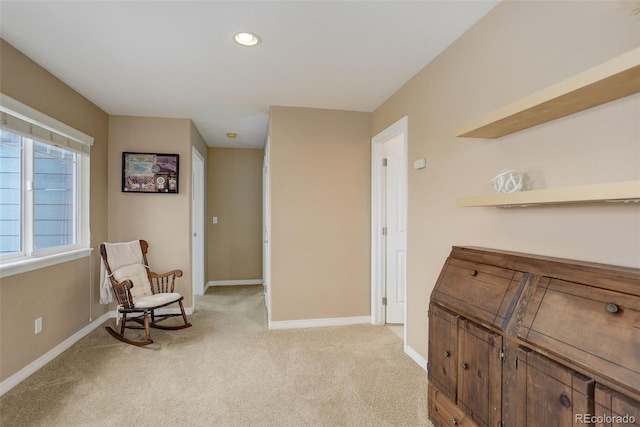 living area with recessed lighting, baseboards, and light carpet