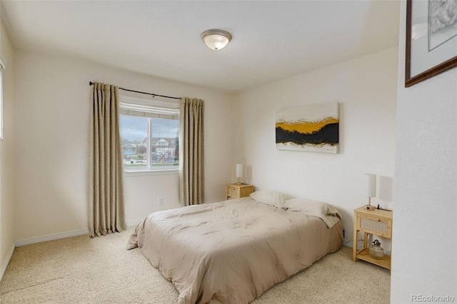 carpeted bedroom with baseboards