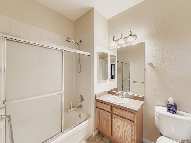 9896 W Freiburg Dr Unit 1D, Littleton, CO 80127 - bathroom with vanity, combined bath / shower with glass door, and a textured wall