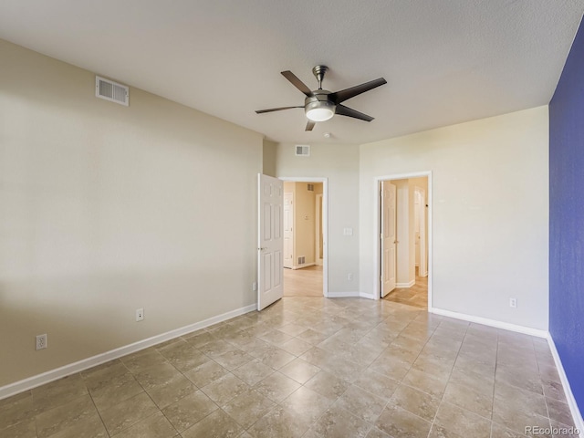 9896 W Freiburg Dr Unit 1D, Littleton, CO 80127 - unfurnished room featuring a ceiling fan and baseboards
