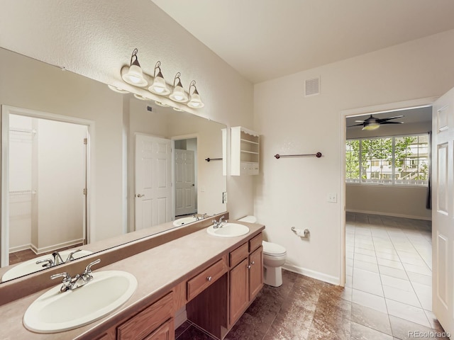 9896 W Freiburg Dr Unit 1D, Littleton, CO 80127 - full bathroom featuring double vanity, a ceiling fan, and a closet