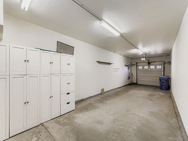 9896 W Freiburg Dr Unit 1D, Littleton, CO 80127 - garage featuring baseboards