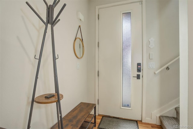 2138 N Glenarm Pl, Denver, CO 80205 - entryway with light wood-type flooring and stairs