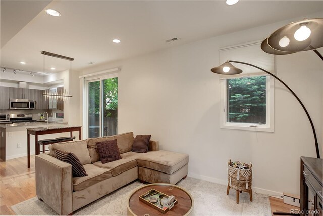 2138 N Glenarm Pl, Denver, CO 80205 - living room with recessed lighting, light wood-type flooring, and baseboards