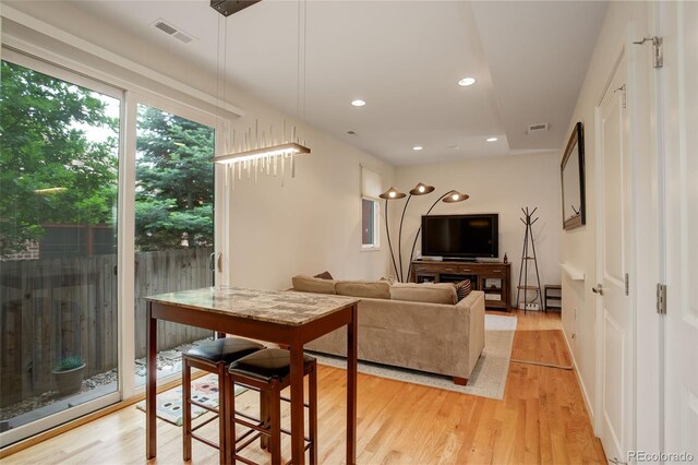 2138 N Glenarm Pl, Denver, CO 80205 - living area featuring light wood-type flooring and recessed lighting