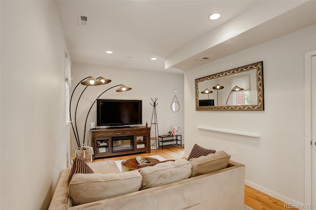 2138 N Glenarm Pl, Denver, CO 80205 - living area with wood finished floors, recessed lighting, and baseboards