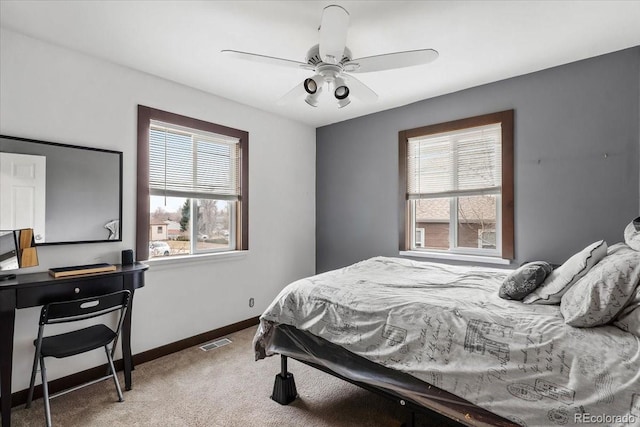 carpeted bedroom featuring ceiling fan